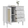 A white sideboard with rattan-optic details and four drawers, shown against a white background. Podgląd zdjęcia produktu