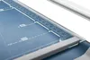 Close-up of a paper trimmer with measurement markings. Voir les images du produit