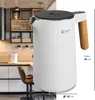 A modern kitchen setting with a white electric kettle as the main focus. Produktbild-Vorschau