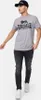 A man wearing a t-shirt and jeans, posing against a white background. Produktbild-Vorschau