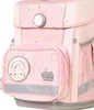 A close-up view of a pink school backpack with rainbow and star patterns. Voir les images du produit