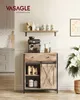 A staged kitchen scene featuring a wooden sideboard with a sliding barn door, displaying coffee-related items. Náhled obrázku produktu