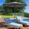 A patio umbrella shades two lounge chairs next to a swimming pool. Anteprima dell’immagine prodotto