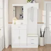 A white entryway storage unit with a mirror, coat hooks, a bench, and cabinets. Podgląd zdjęcia produktu