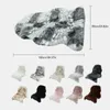A large faux fur rug with a marble pattern is shown, along with a row of smaller samples of the rug in various colors. Produktbild-Vorschau