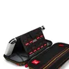 An open Nintendo Switch carrying case showing game cartridges and the console inside. Produktbild-Vorschau