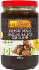 A glass jar of Lee Kum Kee Black Bean Garlic Sauce against a white background. Voir les images du produit
