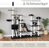 A large cat tree with multiple levels, platforms, and scratching posts, featuring several cats interacting with it. The background is a plain wall with some potted plants. Text overlays describe product features. Produktbild-Vorschau