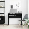 A black desk with a computer and keyboard in a room with a shelf and a chair. Podgląd zdjęcia produktu