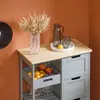 A kitchen cart with fruit and glassware on top and in a drawer. Produktbild-Vorschau