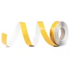 A roll of double-sided tape is unspooling in a spiral shape against a white background. Produktbild-Vorschau