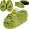 Multiple views of green Grinch-themed slippers. Produktbild-Vorschau