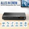 A Strex DVD player is shown on a wooden surface, with marketing text and feature icons above it. A TV screen is partially visible in the background. Voir les images du produit