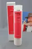 A product shot of a shampoo bottle and its packaging, with a blurred background image of a person. Produktbild-Vorschau