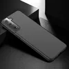 A black smartphone case is shown from a diagonal angle on a dark, textured surface with dramatic lighting. Produktbild-Vorschau