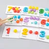A close-up shot of a Montessori learning set for children, featuring number cards with corresponding colored beads and wooden tweezers. Produktbild-Vorschau