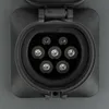 A close-up view of an electric vehicle charging port with multiple pins. Náhled obrázku produktu