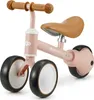 A pink balance bike with brown handlebars and seat, shown against a white background. Voir les images du produit