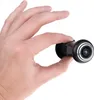 A hand holding a small black and silver electronic device with a lens. Produktbild-Vorschau