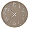 A taupe-colored wall clock with white numbers and hands, set against a white background. Produktbild-Vorschau