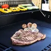 A grill mat with food items on a grill. Náhľad obrázku produktu