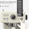 Close-up of a beige espresso machine with a digital display and buttons, showing a hand interacting with it. Náhled obrázku produktu