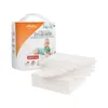 A package of disposable underpads for babies is shown next to a stack of the pads. Voir les images du produit
