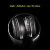 A pair of black, foldable headphones is shown against a black background. Produktbild-Vorschau