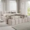 A bedroom scene with a bed as the main focus. Voir les images du produit