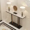 A console table with two lamps and a decorative object on it, placed in an entryway or hallway. Podgląd zdjęcia produktu