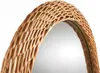 A close-up view of the woven wicker frame of a mirror. Náhled obrázku produktu