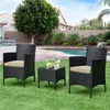 A patio furniture set with two chairs and a table is set up on a grassy lawn next to a swimming pool. Produktbild-Vorschau