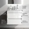 A white bathroom vanity with two drawers is shown mounted on a wall, with a sink and faucet on top. Text overlays describe features of the vanity. Produktbild-Vorschau