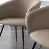 Close-up of two beige upholstered chairs with black metal legs. Produktbild-Vorschau