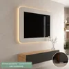 A modern living room with a wall-mounted TV and a media console. Produktbild-Vorschau