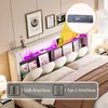 A bed with a headboard featuring shelves, LED lighting, and USB ports, presented in a bedroom setting. Produktbild-Vorschau