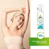 A woman with her arms raised, smiling, next to a product bottle and marketing text. Produktbild-Vorschau