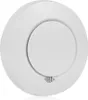 A white, circular smoke detector is shown from a slightly elevated angle against a white background. Produktbild-Vorschau