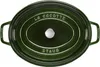 A top-down view of a green oval Staub cocotte pot. Náhled obrázku produktu
