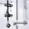 A black shower organizer with two shelves and hooks, holding various bottles and a loofah, inside a shower stall. Produktbild-Vorschau
