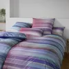 A neatly made bed with a striped duvet and pillows. Produktbild-Vorschau