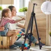 A mother and daughter are painting together on an easel in a bright, indoor setting. Podgląd zdjęcia produktu