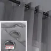 A close-up view of a grey curtain with metal eyelets, showing a measurement indicator. Produktbild-Vorschau