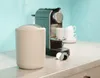 A taupe cosmetic bin and a coffee machine are on a countertop. Produktbild-Vorschau