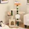 A cat tree with two cats is shown in a room with a couch and a plush penguin toy. Podgląd zdjęcia produktu
