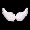 A pair of white angel wings on a black background. Produktbild-Vorschau