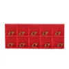 A red plastic box containing ten small, diamond-shaped metal inserts, likely for CNC machining. Náhľad obrázku produktu