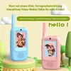 Two children's walkie-talkies, one blue and one pink, are displayed on a colorful stand with cartoon-like trees in the background. Text overlays highlight product features. Produktbild-Vorschau