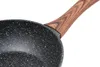 Close-up of a black speckled pan with a wooden handle. Produktbild-Vorschau