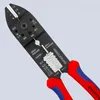 A close-up shot of a black wire stripper tool with red and blue handles, set against a light gray background. Voir les images du produit